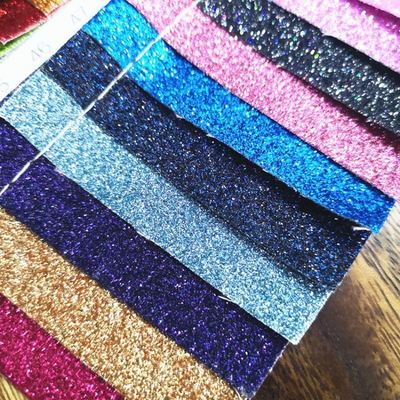 Por mayor PU Glitter en polvo grano de cuero sintético cartera de bolsillo zapatos portátil tejido de cuero