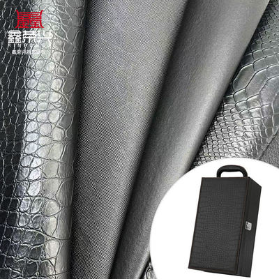 Mayorista de PVC cuero de imitación cartera caja zapatos cuaderno lichi animal tejido cruzado patrón artificial tela de cuero sintético