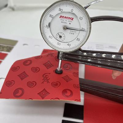 Cuero sintético prensado de PU para bolsa de zapatos, paquete, mantel, tela de cuero sintético