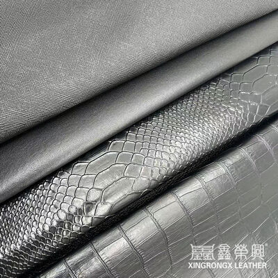 Mayorista de PVC cuero de imitación cartera caja zapatos cuaderno lichi animal tejido cruzado patrón artificial tela de cuero sintético